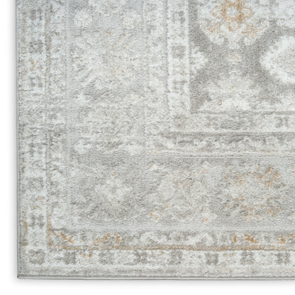 Soft gray & ivory distressed oriental-pattern area rug with beige accents.