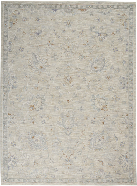 Rectangular area rug in soft beige with pale blue-gray florals and ornate border, vintage distressed look, 8' x 10'.
