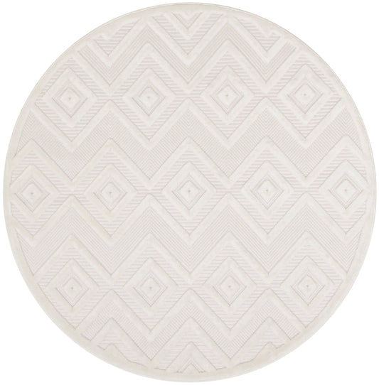 Round cream rug with embossed diamond geometric pattern and soft textured weave.