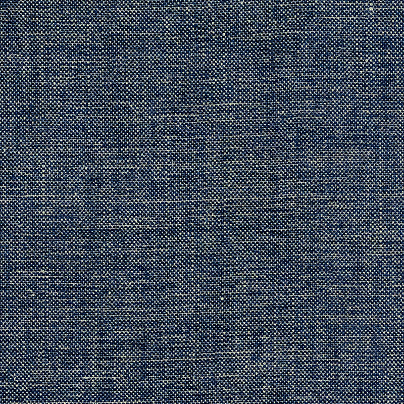 Close-up of dark blue denim fabric weave with lighter threads.