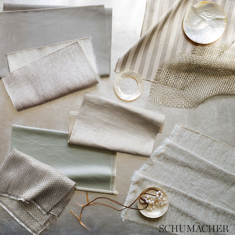 Neutral satin fabric swatches in beige, ivory, and sage.