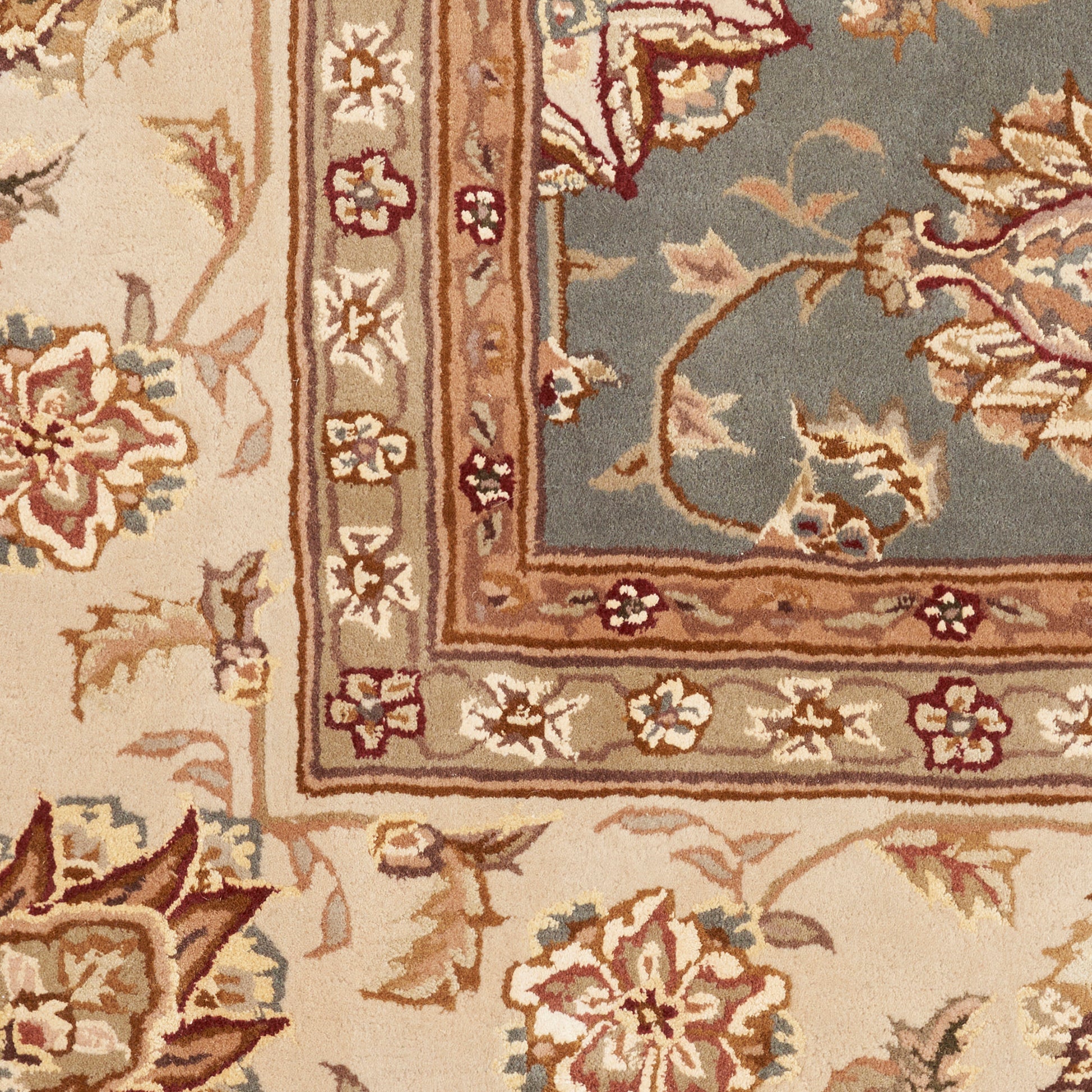 Beige oriental area rug with floral motifs in cream, blue, and rust; decorative multi-border design.