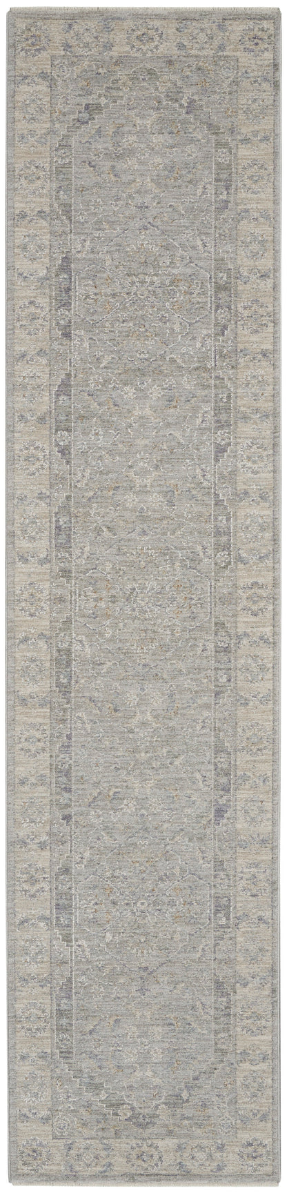 Long runner rug in muted gray and beige with classic Persian-style medallion pattern and ornate border.