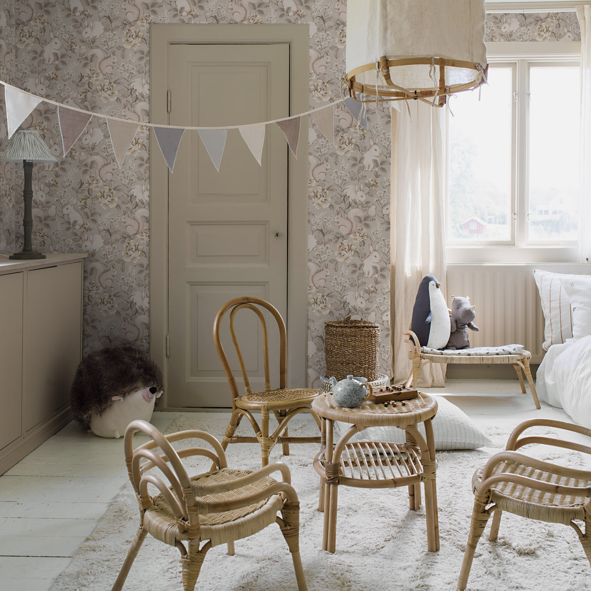 Taupe forest wallpaper with a subtle woodland motif on the wall.