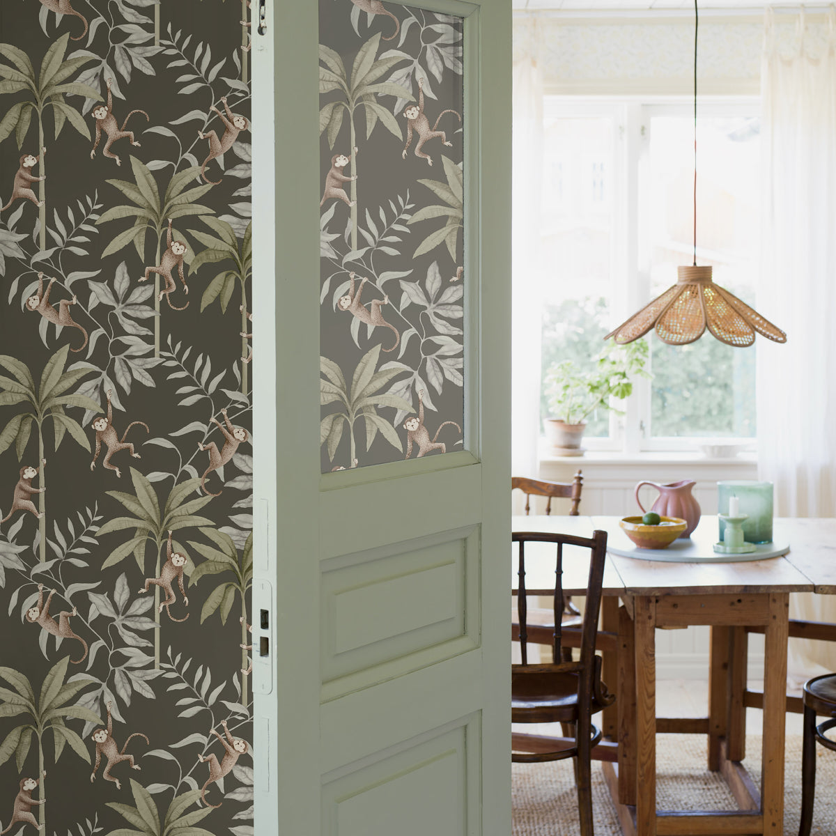 Sage green palm-leaf wallpaper.