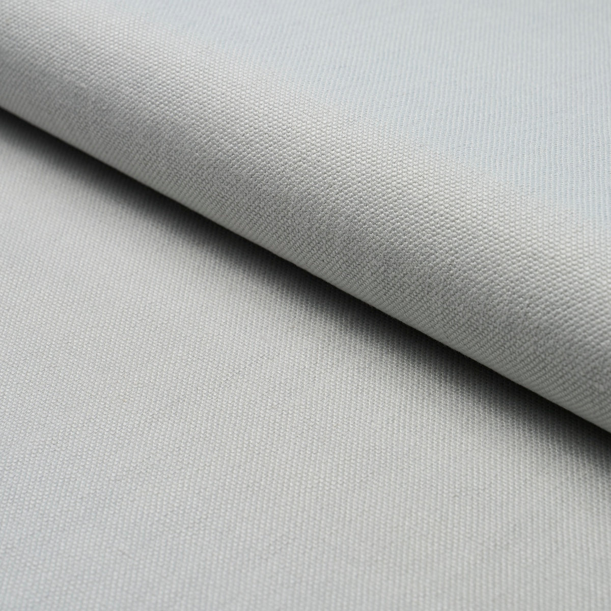 Light gray woven fabric with subtle texture, folded layer, upholstery-style textile.