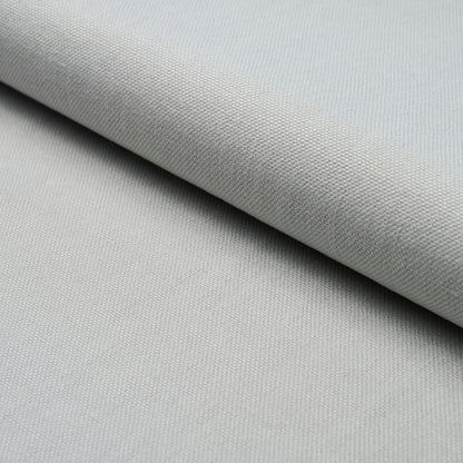 Light gray woven fabric with subtle texture, folded layer, upholstery-style textile.