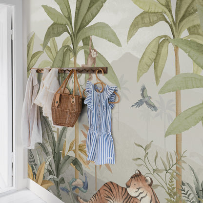 Wood clothing rack with white blouse, blue striped dress, and a rattan basket against tropical jungle wallpaper.