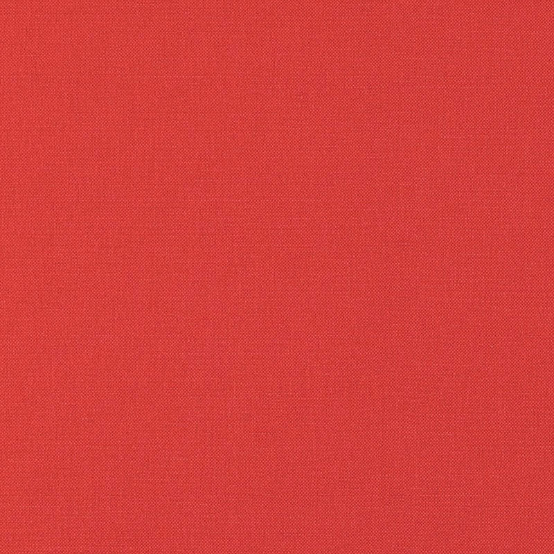 Close-up of red textured fabric with a subtle dotted pattern; warm upholstery textile.