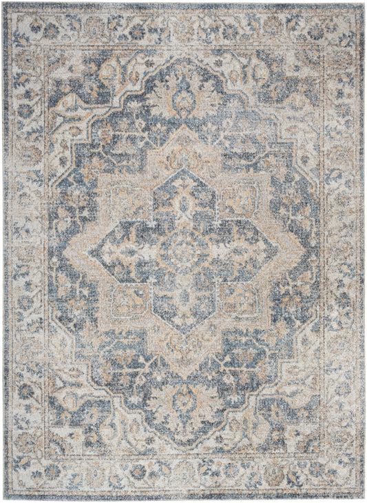 Blue and ivory distressed oriental area rug with a central geometric medallion and ornate border.