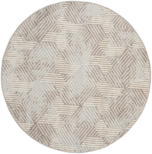 Round geometric area rug in beige and gray with interlocking chevron blocks; modern textured weave