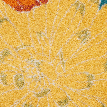 Close-up of bright yellow shag rug with abstract floral pattern in orange, green & teal.
