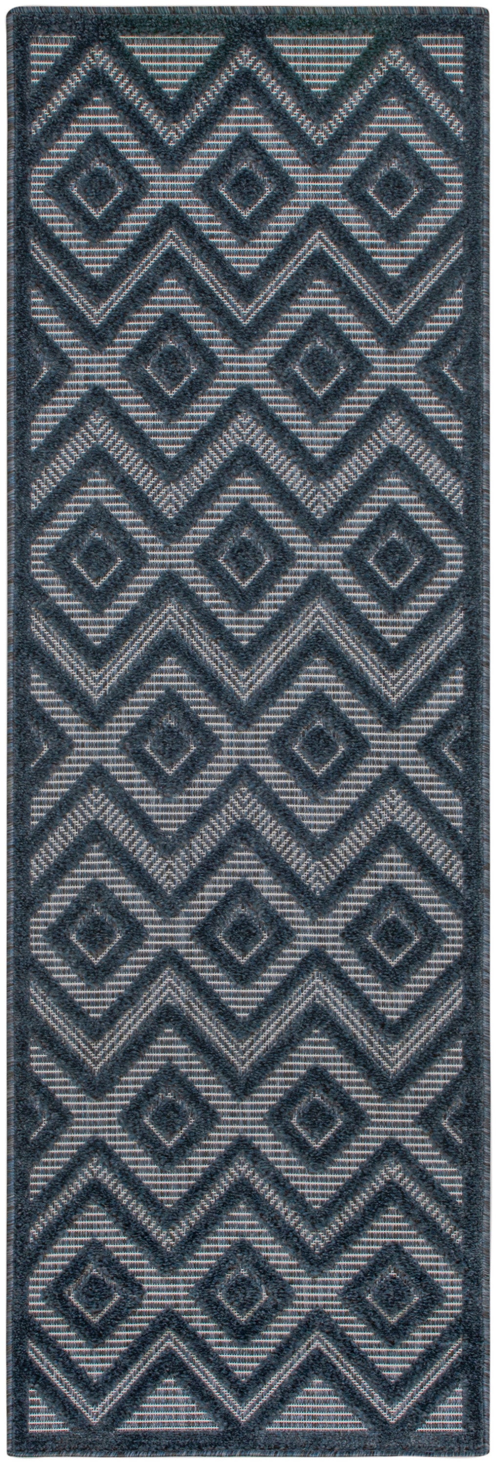 Blue-gray geometric rug runner with raised chevron and diamond motifs in navy, textured woven.