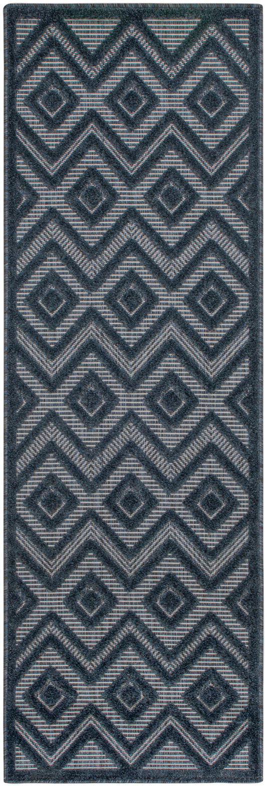 Blue-gray geometric rug runner with raised chevron and diamond motifs in navy, textured woven.