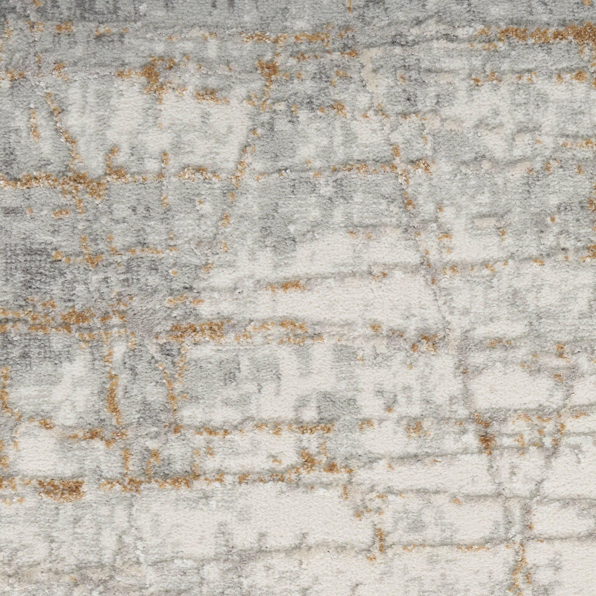 Rectangular abstract rug in light gray and ivory with subtle gold accents; modern woven texture.