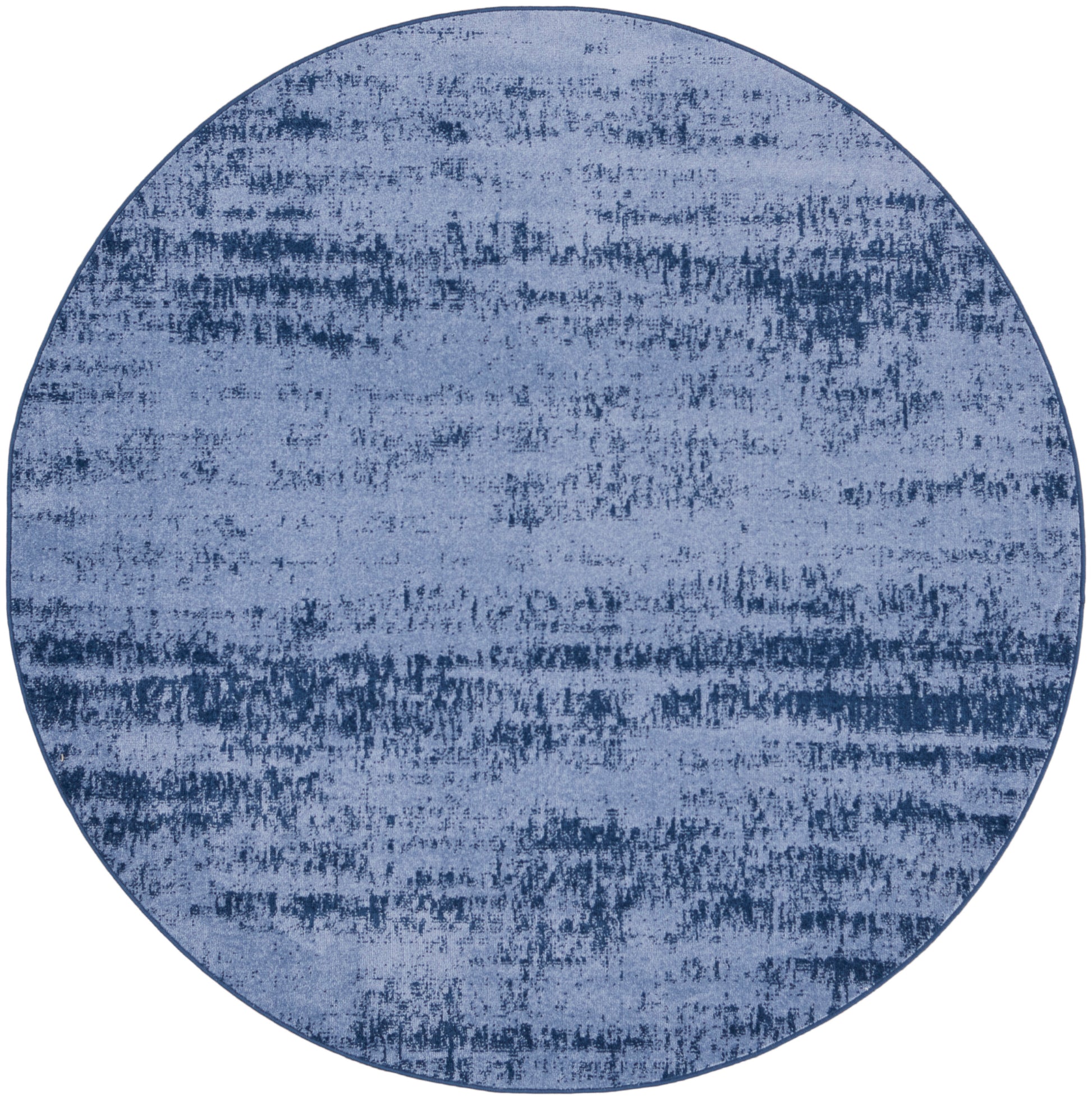 Round blue rug with distressed abstract texture in denim tones, soft surface.