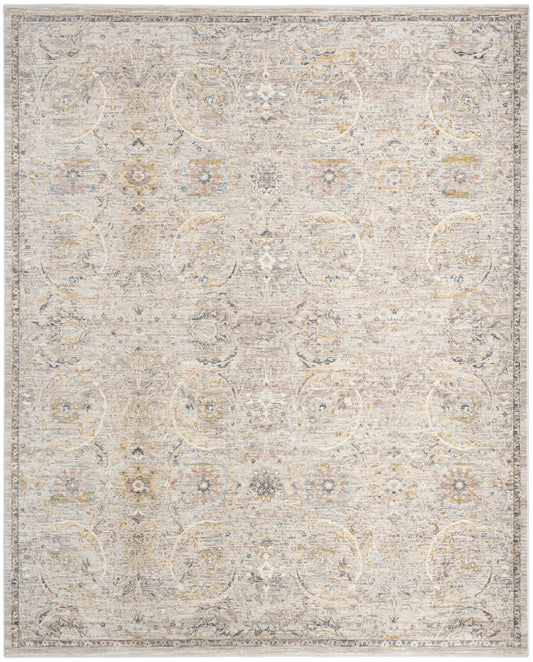 Neutral-toned distressed oriental area rug with soft floral medallion pattern in ivory, beige and pale blue.