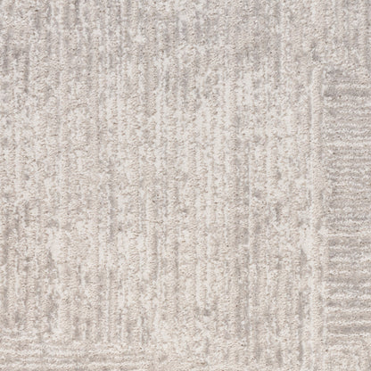 Beige-gray textured rug with subtle vertical linear pattern and soft woven pile.