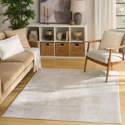 Neutral living room with beige sofa, wooden armchair, light textured rug, and cubby shelves with wicker baskets.