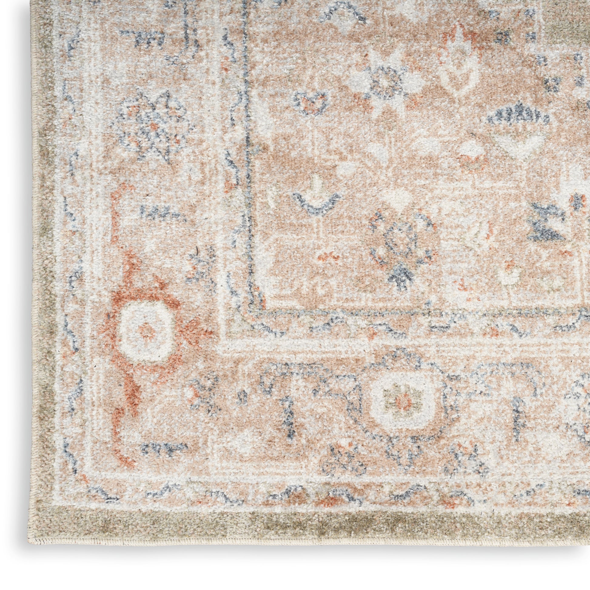 Rectangular oriental-style rug with a distressed peach, cream and blue floral pattern.