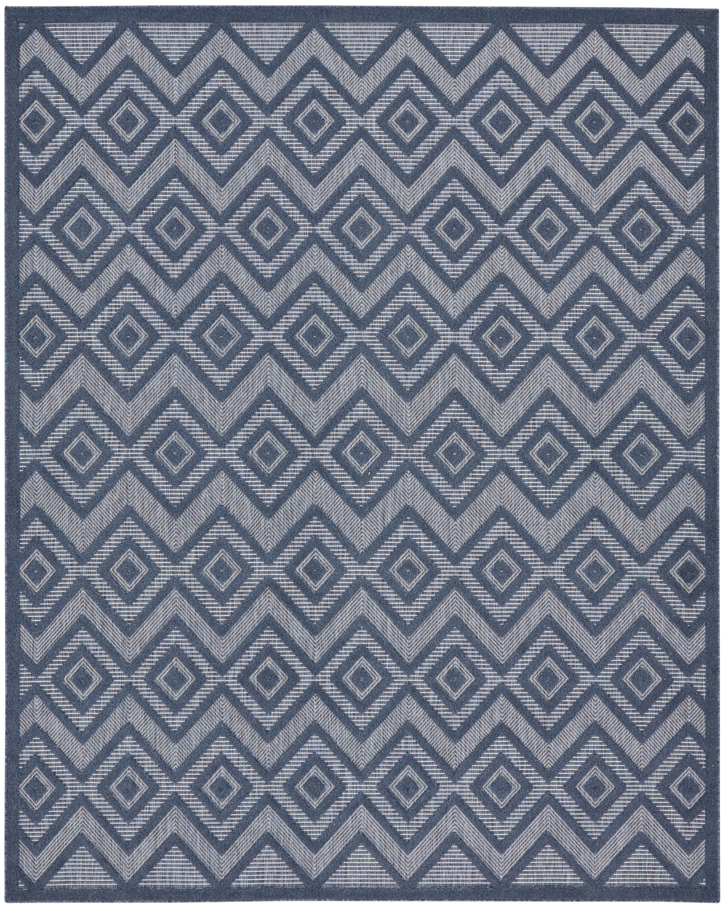Blue geometric rug with interlocking diamonds & chevron pattern in navy & light gray.