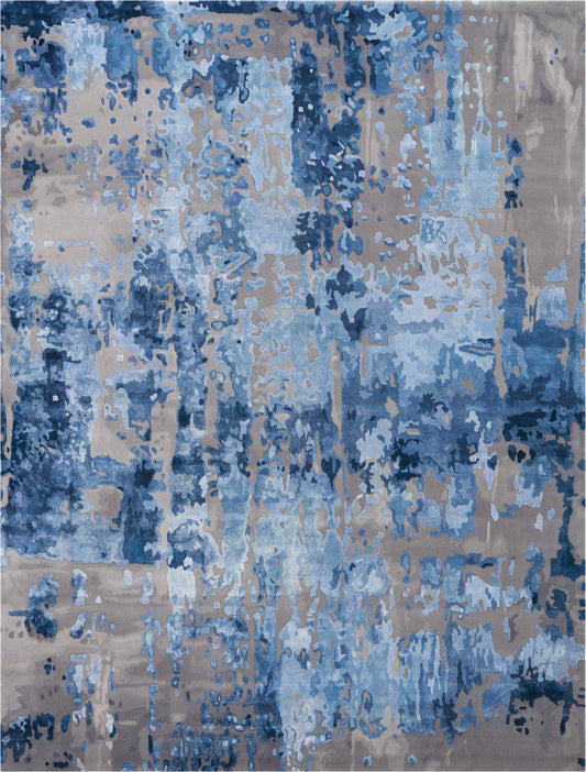 Abstract blue and beige area rug with a distressed painterly pattern; navy, sky blue and taupe tones for modern decor.