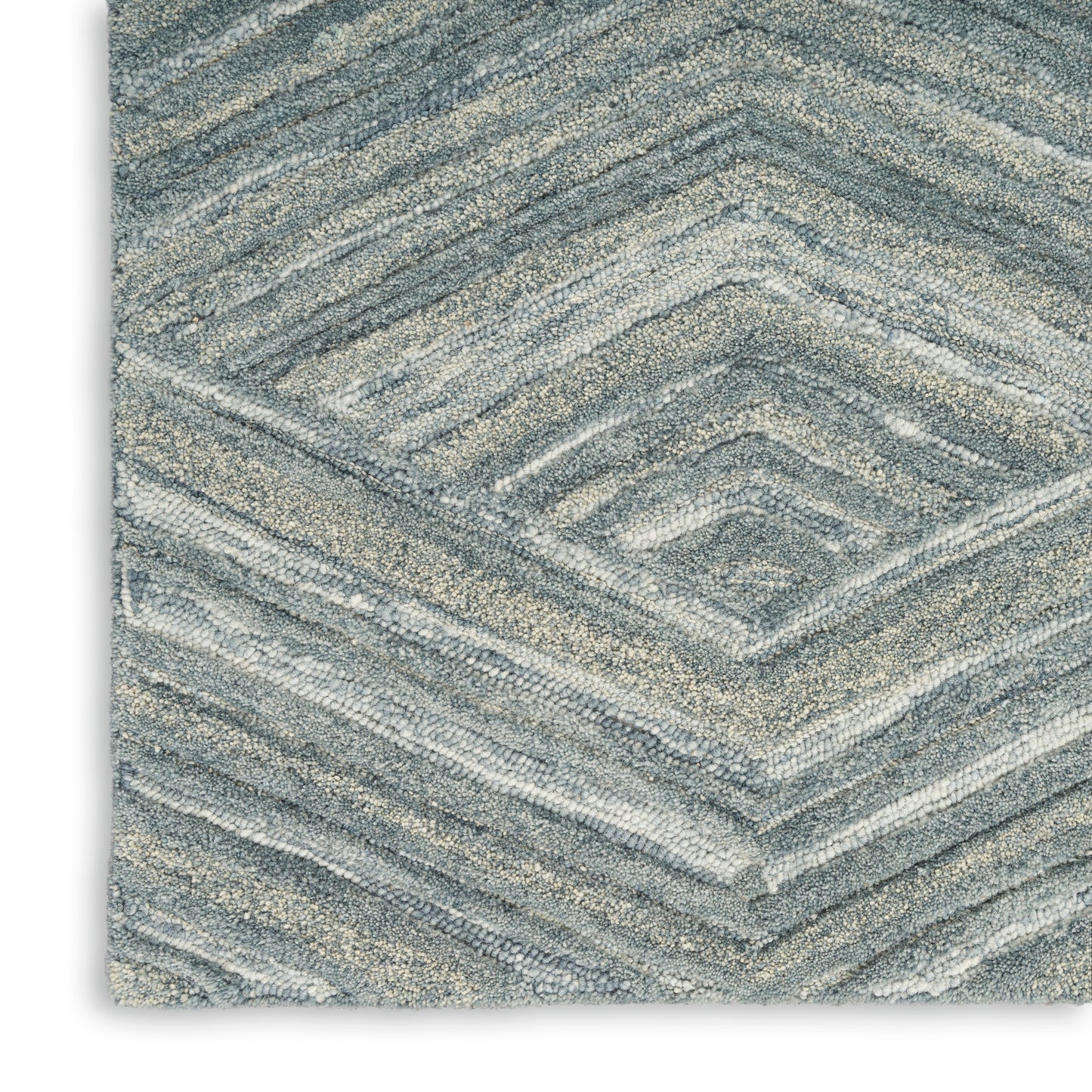 Blue-gray chevron-pattern rectangular rug with plush, textured pile.