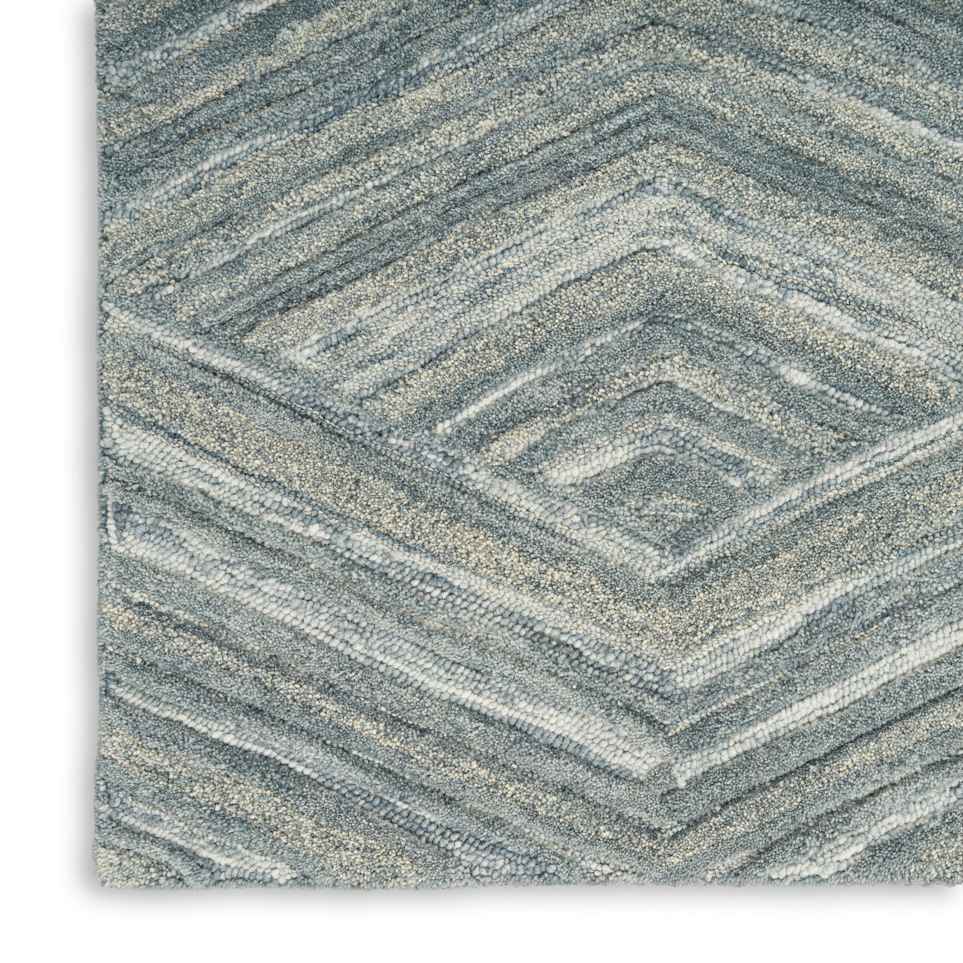 Blue-gray chevron-pattern rectangular rug with plush, textured pile.