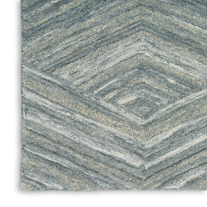 Blue-gray chevron-pattern rectangular rug with plush, textured pile.