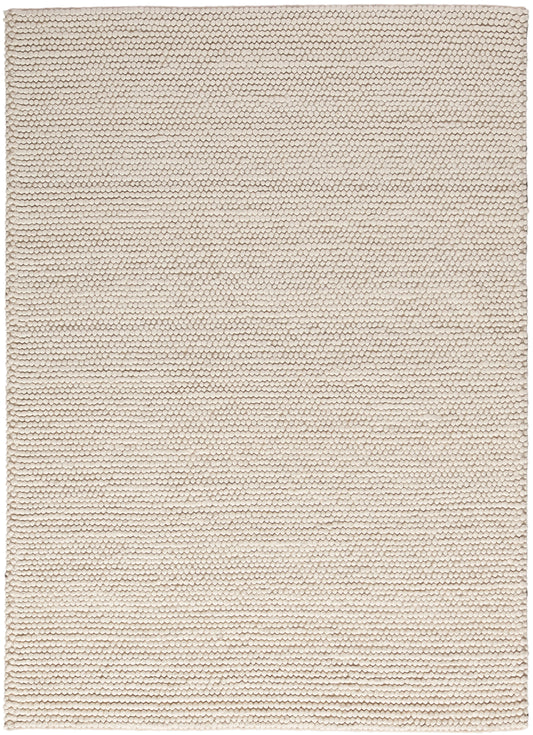 Beige cream rug with tight loop texture and small scale hexagonal pattern; rectangular, neutral home decor.