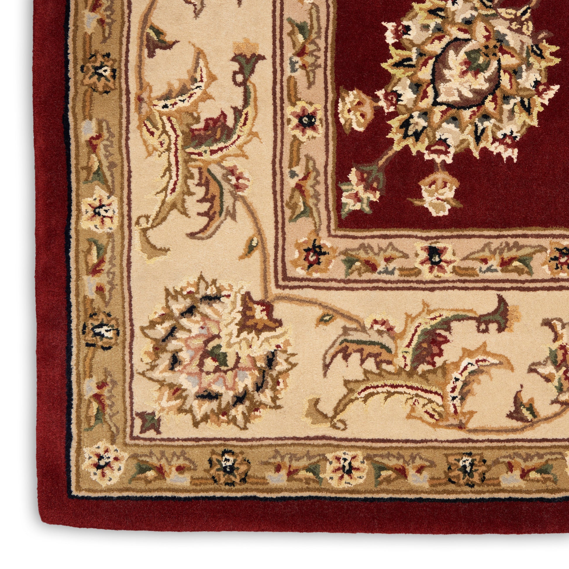 Traditional oriental rug corner with beige field, burgundy inset and ornate floral border; rectangular wool decor.