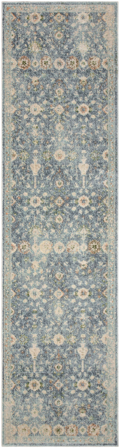 Blue-gray runner rug with cream floral motifs and a pale border.
