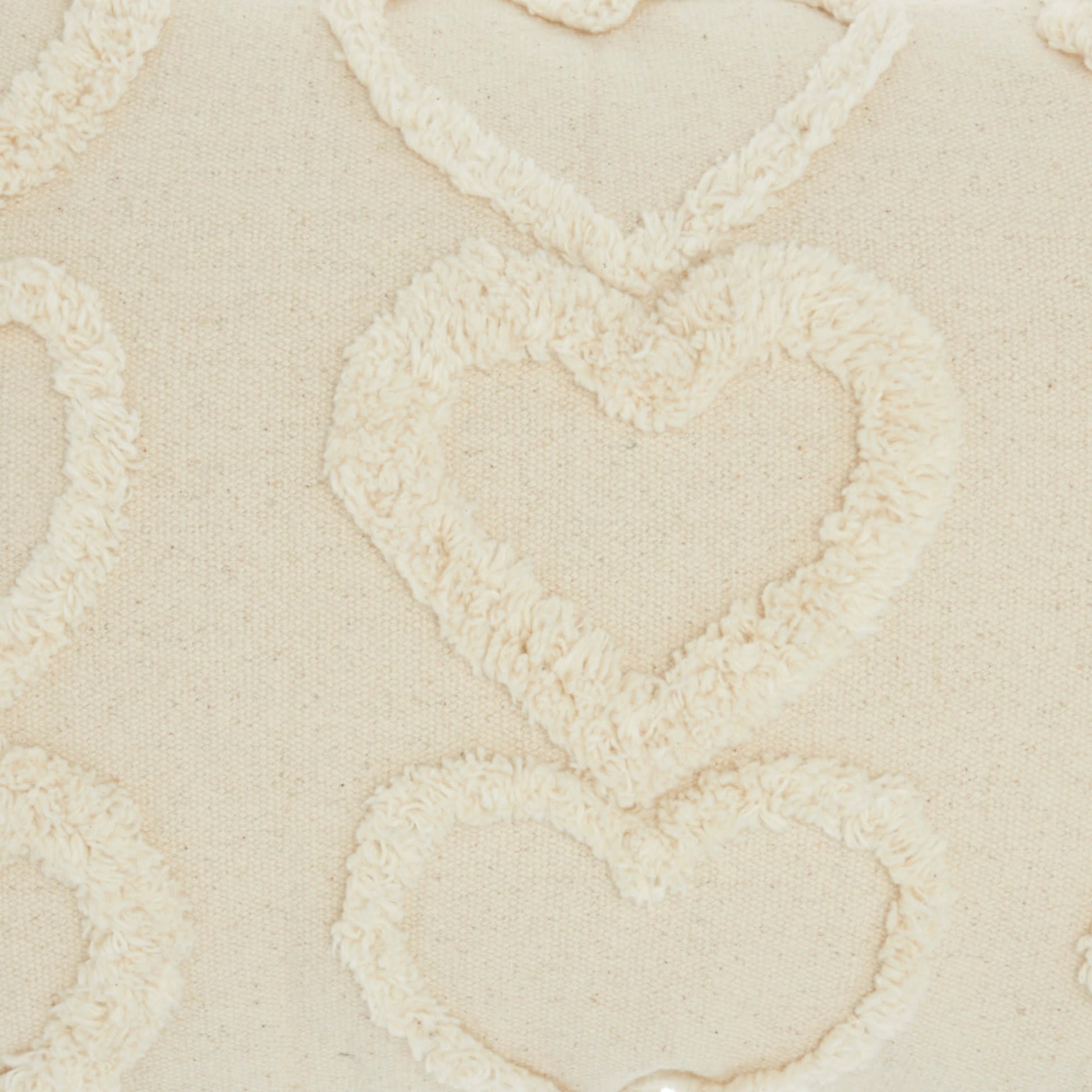 Beige rug with cream looped-yarn texture in a soft, repeating pattern (14" x 20").
