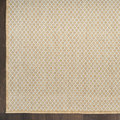 Beige rectangular fabric rug with delicate white lace trim along the bottom edge on a wooden floor.