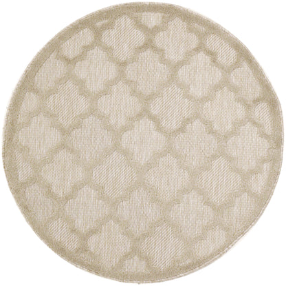 Round beige rug with woven lattice diamond pattern; neutral, textured floor decor.