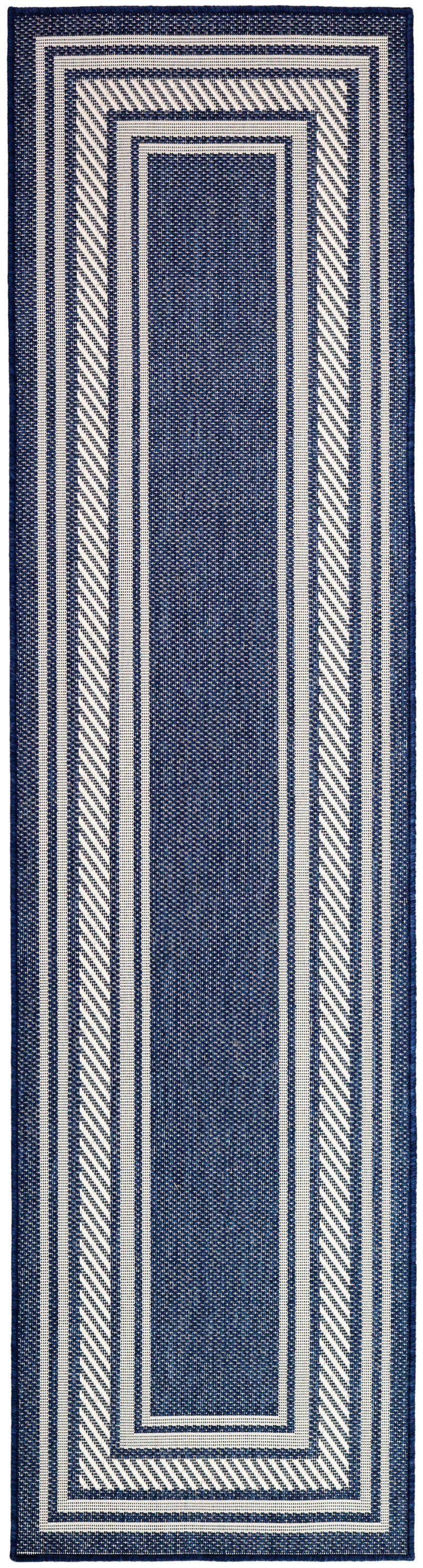 Navy blue and white woven runner rug with nested rectangular borders and diagonal striped edges.