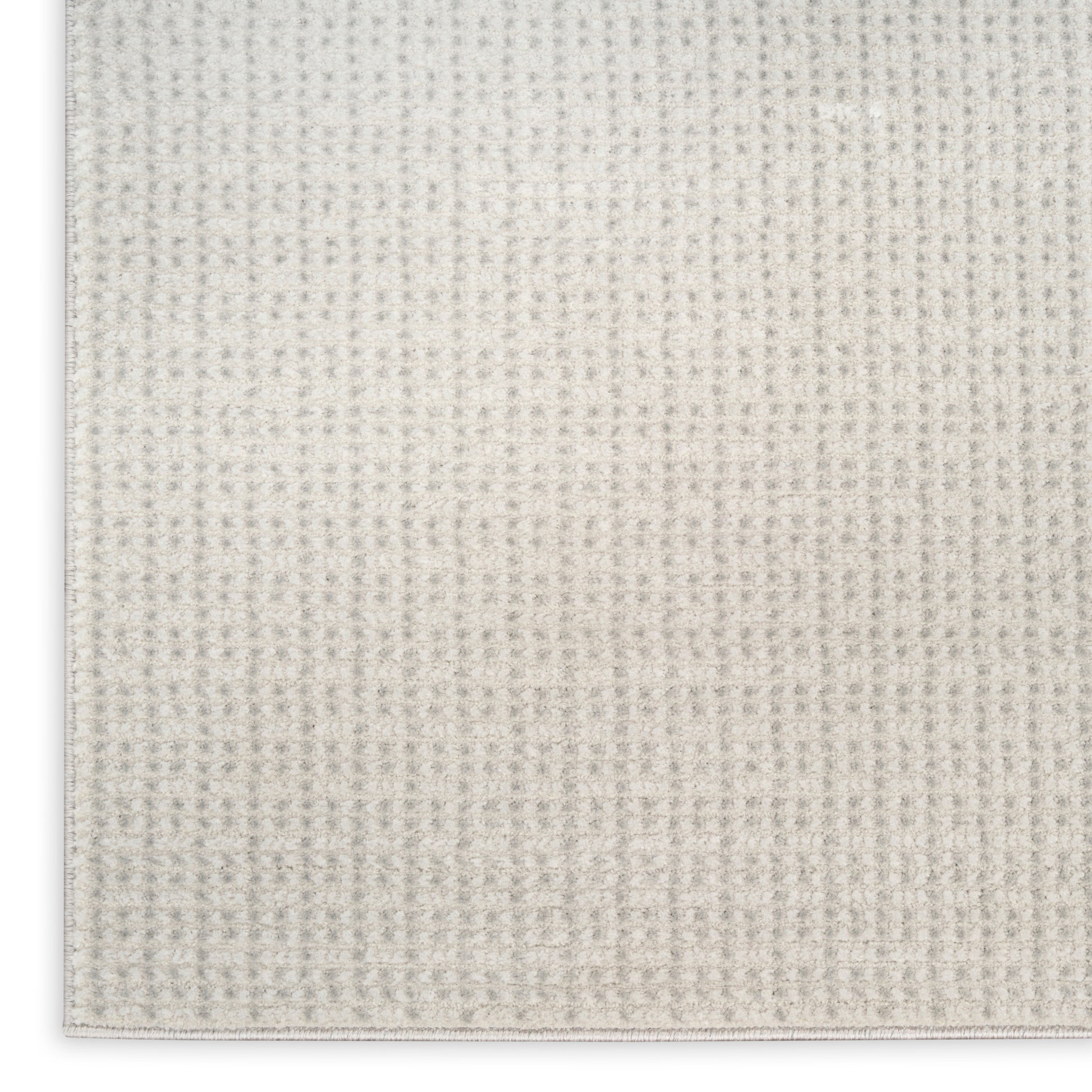 Beige woven fabric texture close-up with a tiny grid pattern, soft neutral textile for upholstery or decor.