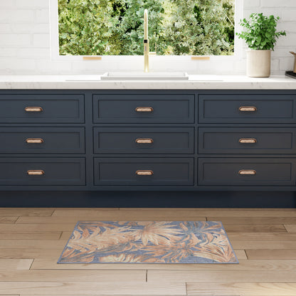 Navy blue rug with a leafy pattern on a wooden floor.