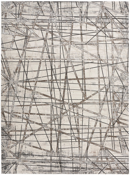 Neutral abstract rug with intersecting gray lines forming a geometric, textured beige backdrop.