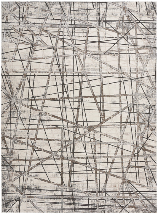 Neutral abstract rug with intersecting gray lines forming a geometric, textured beige backdrop.