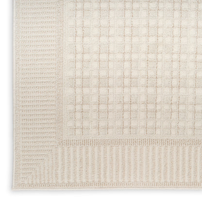 Beige rectangular rug with subtle grid pattern and textured border; soft, neutral, ideal for living room.