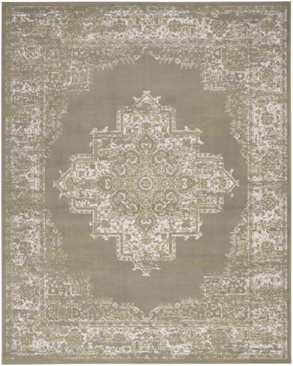 Beige and gray distressed Persian-style rug with an ornate central medallion and intricate bordered edges.