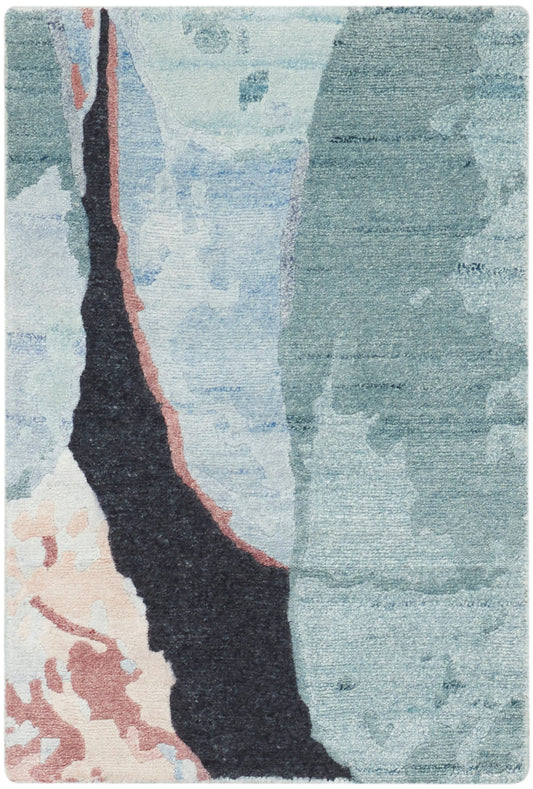Abstract area rug with blues and teal, black jagged center outlined in pink, peach accents.
