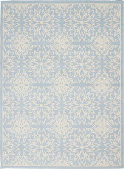 Light blue area rug with white ornate mandala-like floral medallions in a repeating pattern and a pale border.