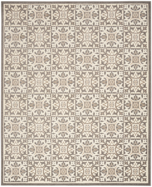 Beige area rug with a grid of ornate taupe tile motifs and scrolling floral patterns; bordered edges.