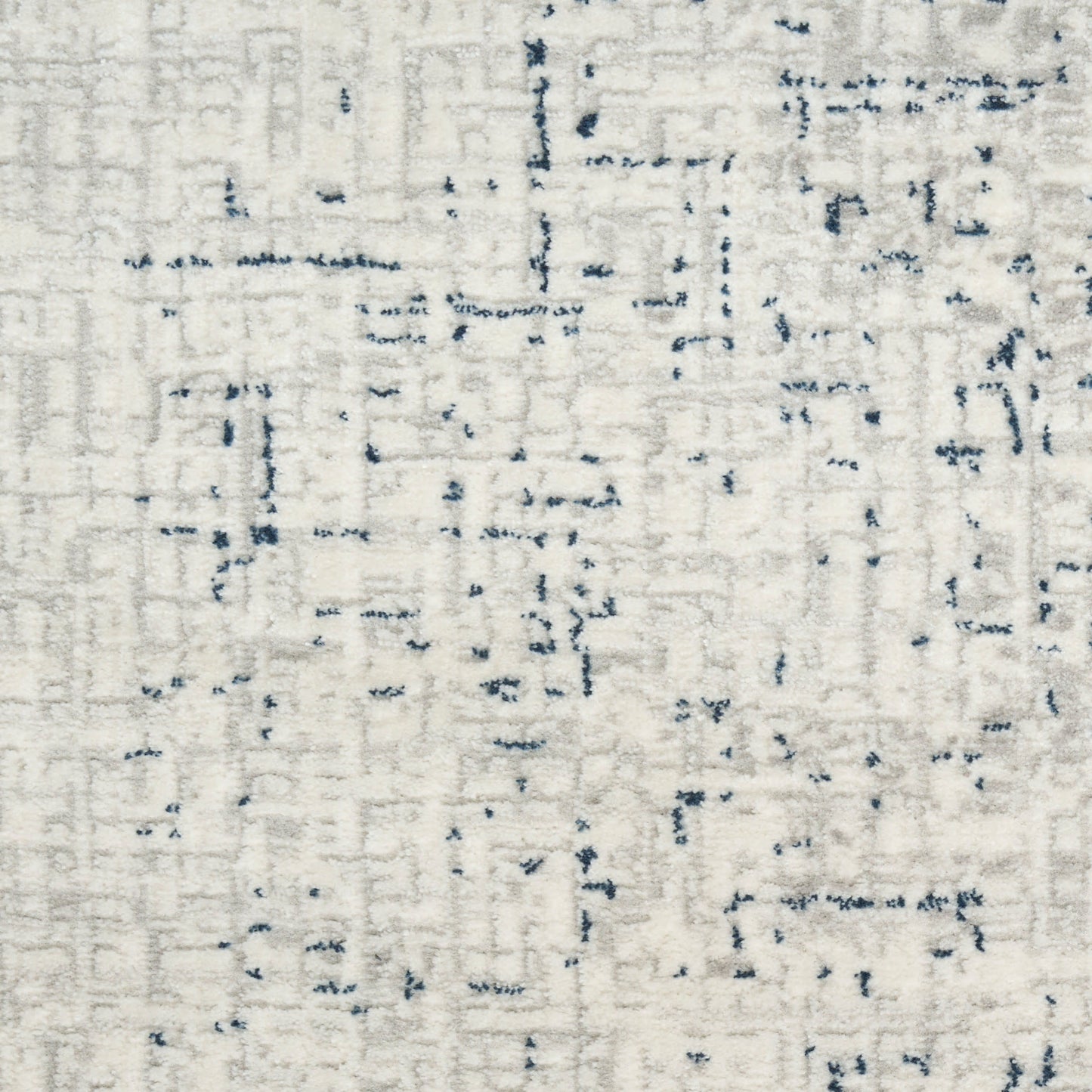 Cream rectangular area rug with a subtle navy blue abstract line pattern.