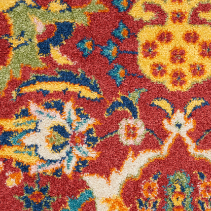 Vibrant oriental rug with red base and multicolored floral motifs in yellow, blue, green, orange, white; plush pile.