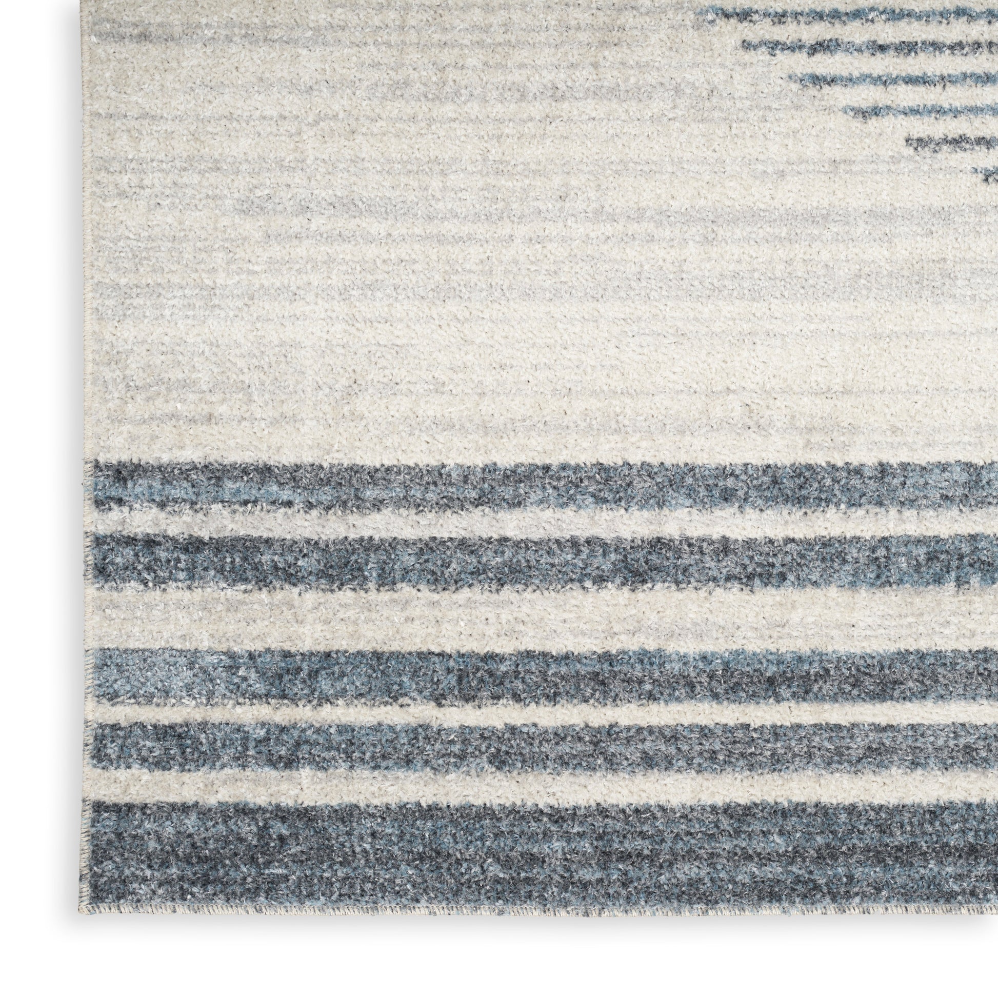 Rectangular cream rug with navy blue horizontal stripes; coastal style, low-pile texture, ideal for living rooms.