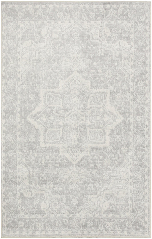 Rectangular light-gray distressed oriental rug with a faded central medallion pattern; versatile living room decor.