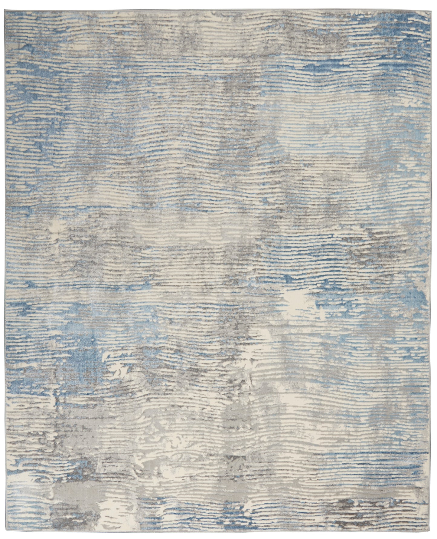 Rectangular area rug in blue, gray and beige with distressed striped texture and soft, muted tones.